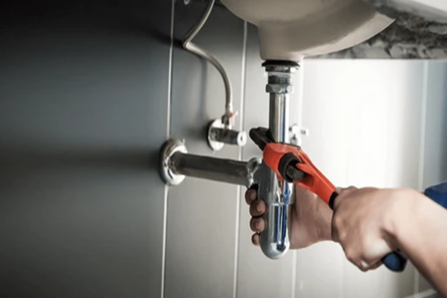 plumber-uses-wrench-repair-water-260nw-2466456607